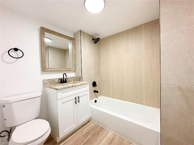 full bathroom featuring hardwood / wood-style flooring, shower / tub combination, vanity, and toilet