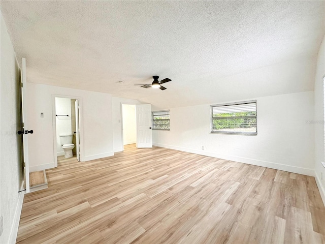 unfurnished room with a textured ceiling, ceiling fan, and light hardwood / wood-style floors