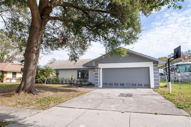 ranch-style home with a front yard and a garage