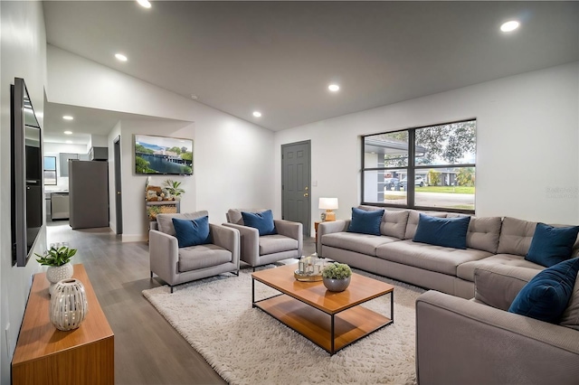 7631 Lewis Rd, Lakeland, FL 33810 - living room with lofted ceiling, recessed lighting, and light wood-style floors