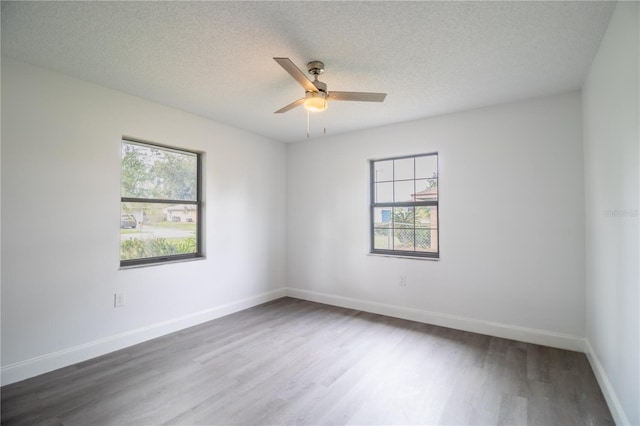 7631 Lewis Rd, Lakeland, FL 33810 - spare room with ceiling fan, baseboards, a textured ceiling, and wood finished floors