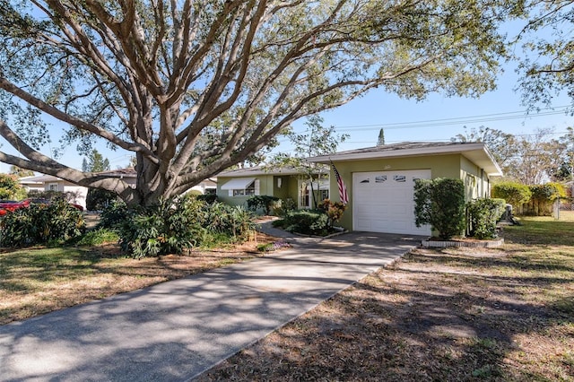 single story home featuring a garage