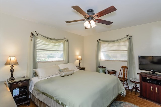 bedroom featuring wood-type flooring and ceiling fan