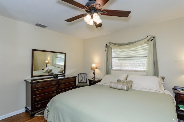 bedroom featuring ceiling fan and dark wood-type flooring