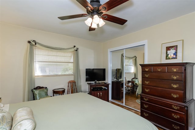 bedroom featuring a closet, ceiling fan, and hardwood / wood-style flooring