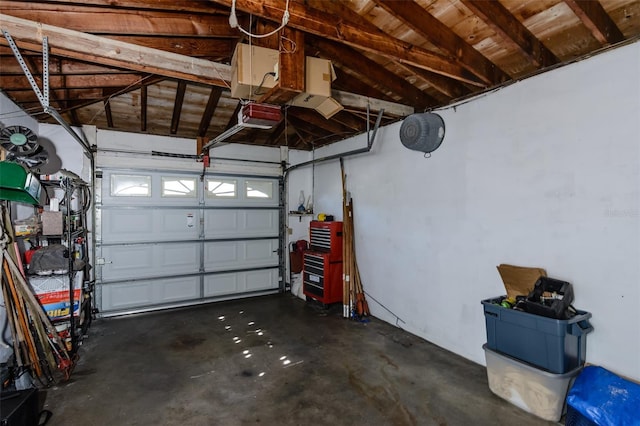 garage with wood ceiling and a garage door opener