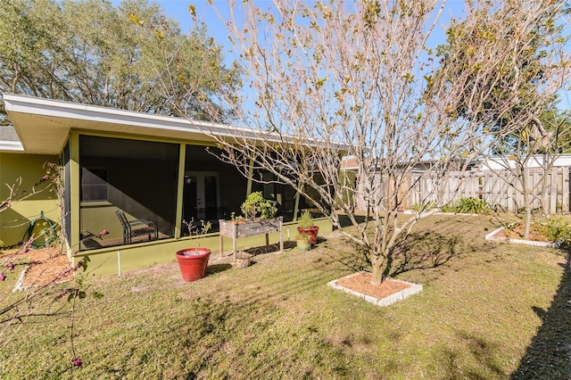 view of yard with a sunroom