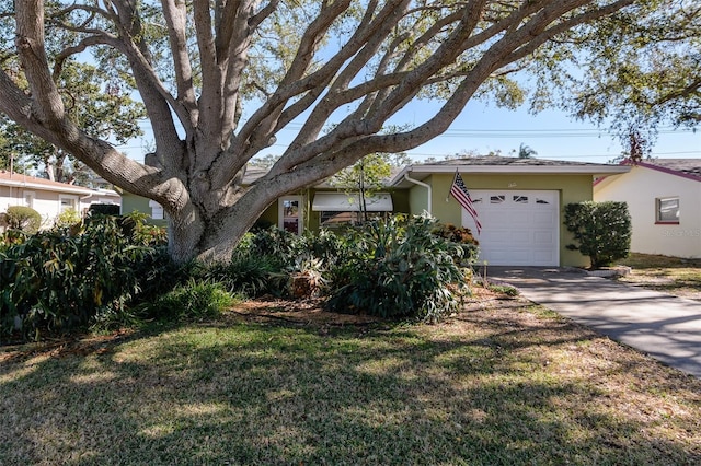 single story home with a front lawn and a garage