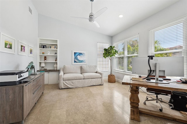 office space with lofted ceiling, ceiling fan, built in features, and a healthy amount of sunlight