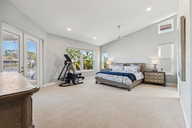 bedroom featuring french doors, light colored carpet, lofted ceiling, and access to exterior