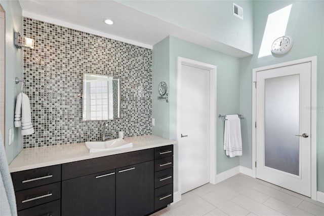 bathroom featuring tile patterned flooring and vanity