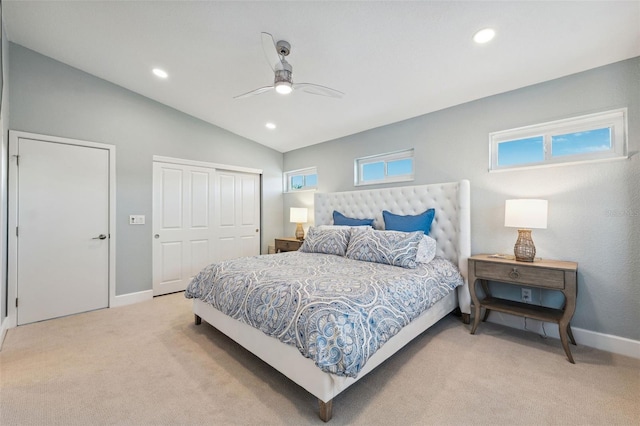 carpeted bedroom with vaulted ceiling and ceiling fan