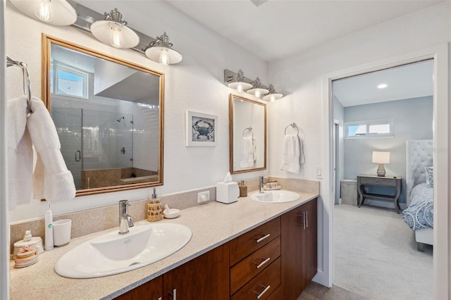 bathroom featuring vanity and a shower with shower door