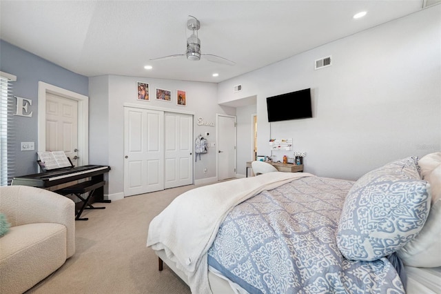 carpeted bedroom with a closet and ceiling fan