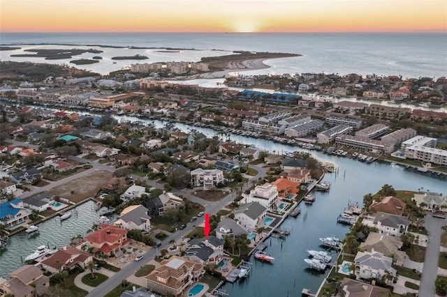 aerial view at dusk with a water view