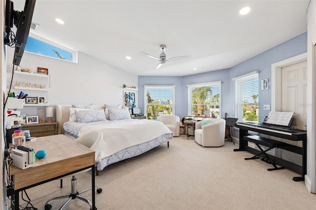 bedroom with vaulted ceiling, light carpet, and ceiling fan