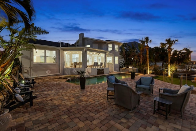 view of patio terrace at dusk