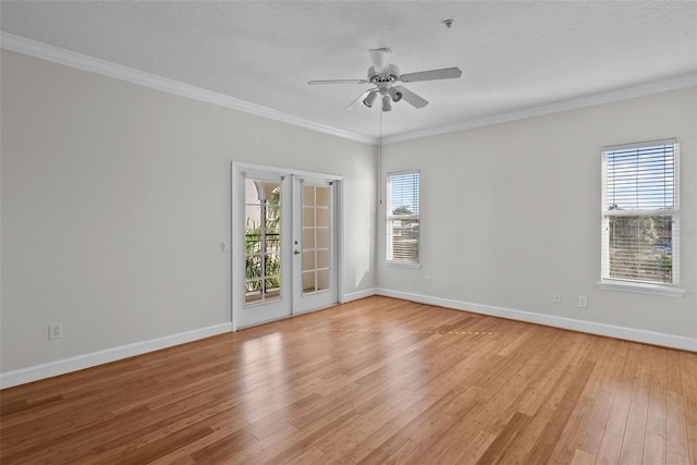 unfurnished room featuring french doors, crown molding, a textured ceiling, light hardwood / wood-style flooring, and ceiling fan