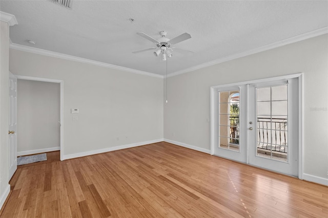 empty room with ceiling fan, ornamental molding, a textured ceiling, and light wood-type flooring