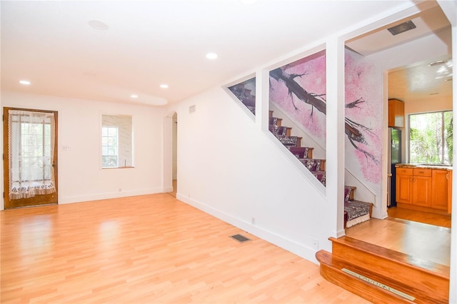 interior space featuring hardwood / wood-style flooring and a wealth of natural light