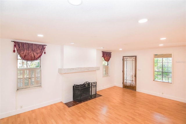 unfurnished living room with hardwood / wood-style floors