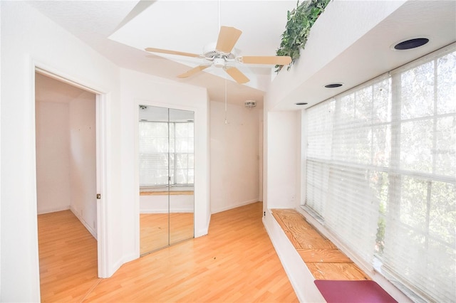 unfurnished room with ceiling fan and hardwood / wood-style flooring