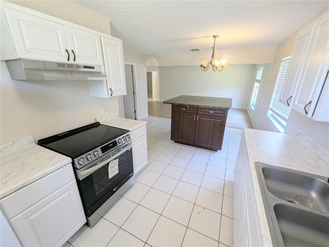 kitchen with stainless steel range with electric stovetop, a notable chandelier, white cabinets, and sink