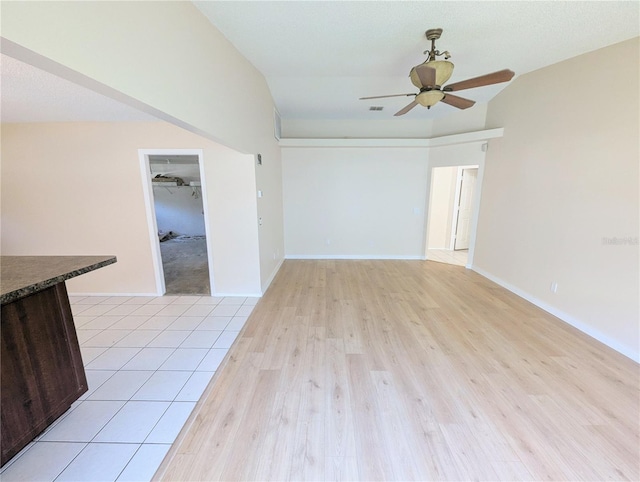 spare room featuring ceiling fan and light hardwood / wood-style floors