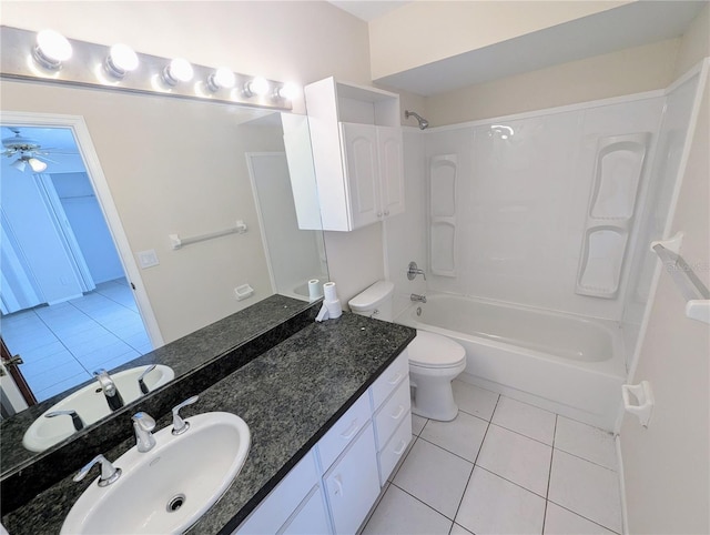 full bathroom featuring vanity, washtub / shower combination, tile patterned flooring, ceiling fan, and toilet