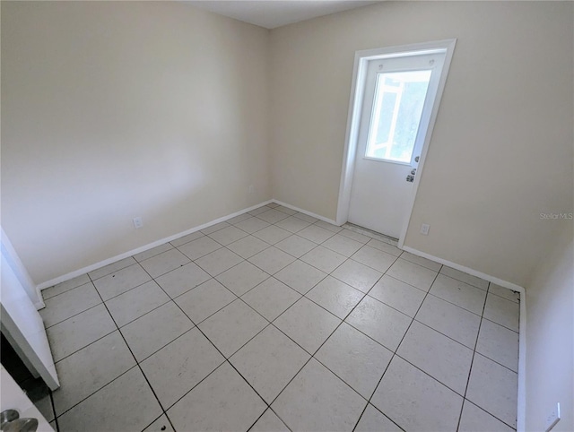 spare room with light tile patterned flooring