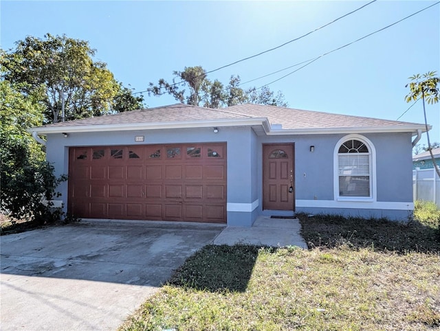 single story home featuring a garage