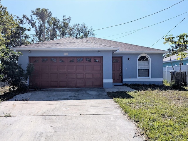 single story home featuring a garage