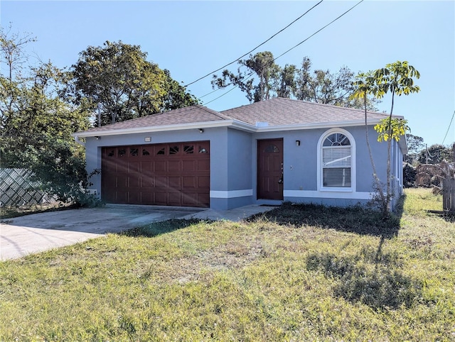 ranch-style home with a garage and a front lawn