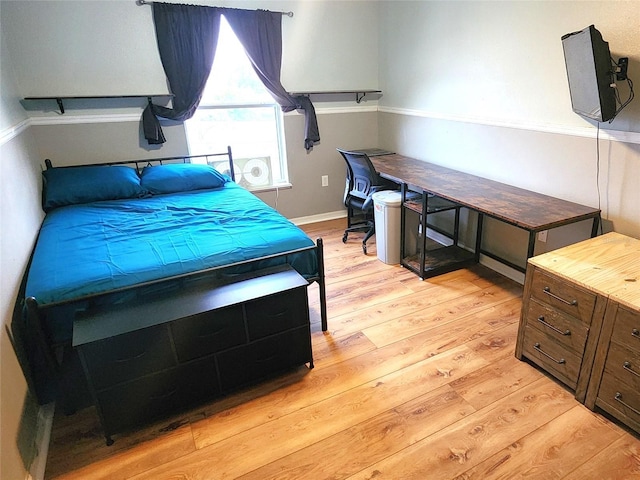 bedroom with light hardwood / wood-style floors