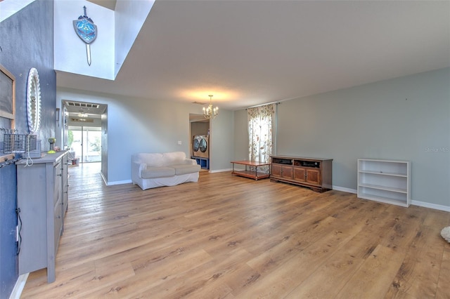 sitting room with light hardwood / wood-style flooring and a chandelier