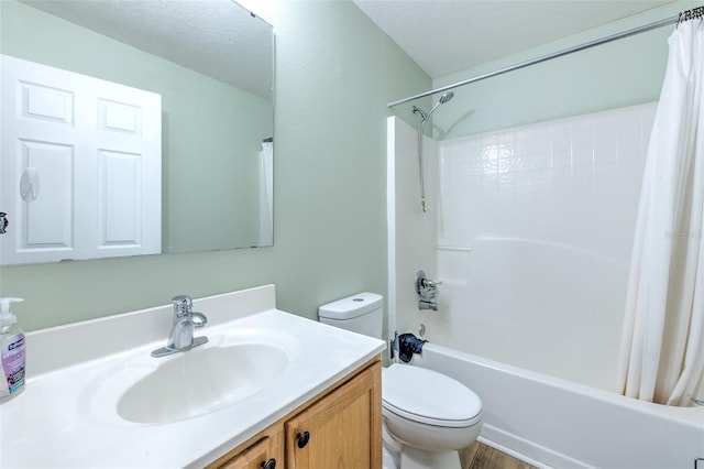 full bathroom with vanity, shower / bath combination with curtain, and toilet