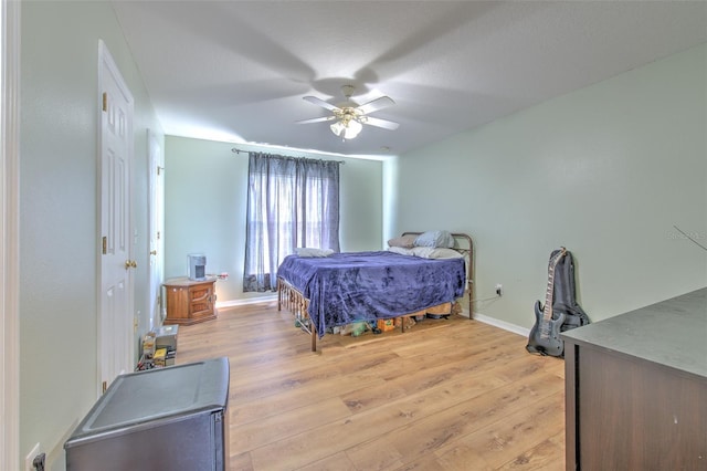 bedroom featuring ceiling fan and light wood-type flooring