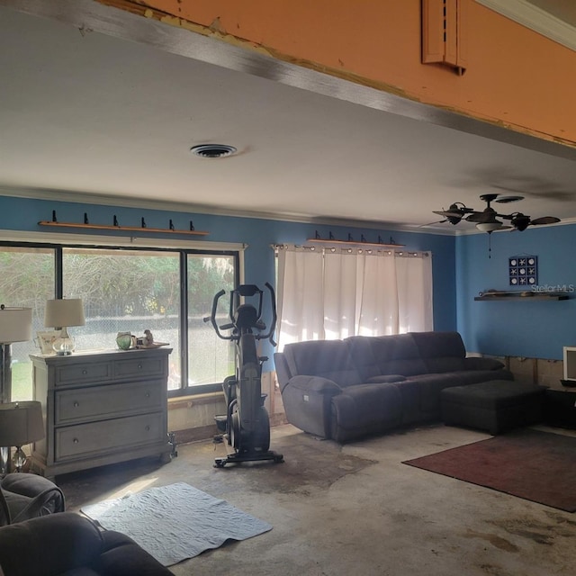 living room featuring ceiling fan, crown molding, and concrete flooring