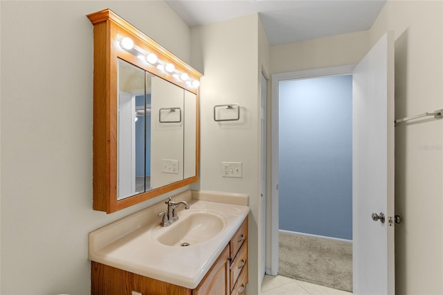 bathroom with tile patterned floors and vanity