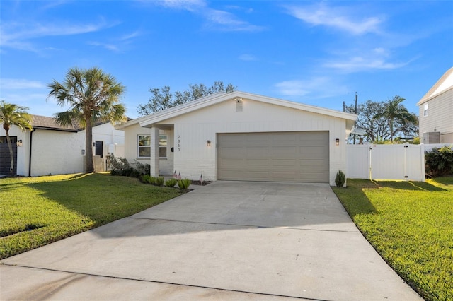 ranch-style house featuring a garage and a front lawn