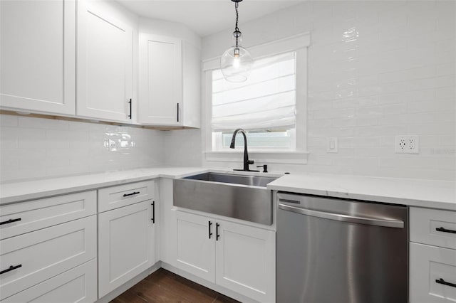 kitchen featuring white cabinetry, dishwasher, sink, hanging light fixtures, and dark hardwood / wood-style floors