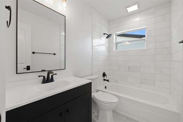 full bathroom with vanity, toilet, and tiled shower / bath