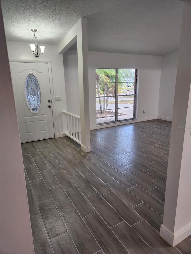 foyer with a notable chandelier