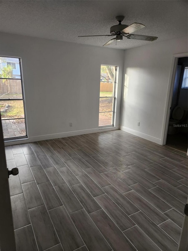 unfurnished room featuring a textured ceiling and ceiling fan