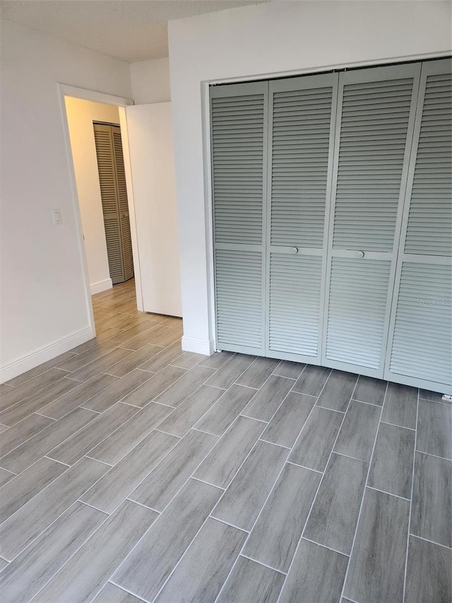 unfurnished bedroom with a closet