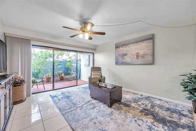 sitting room featuring ceiling fan and light tile patterned flooring