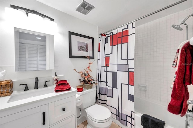 full bathroom featuring tile patterned floors, shower / bathtub combination with curtain, vanity, and toilet