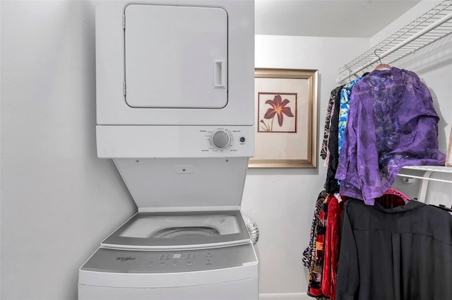 laundry room with stacked washer / dryer