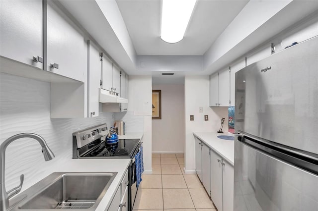 kitchen with white cabinetry, sink, and stainless steel appliances