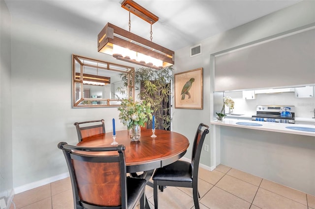 dining area with light tile patterned floors